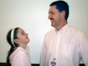 Sarah Cravy laughs at her dad’s blue-dyed hair. Her dad happens to be Jeff Cravy
