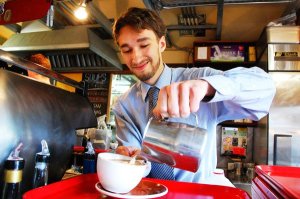 South Whidbey resident Aaron Simpson serves up a cup of coffee at the Useless Bay Coffee Co. in Langley. The young Democrat is challenging Norma Smith for the District 10 position 1 spot in the state Legislature.