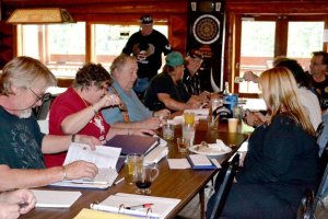 Members of the Legion Riders make plans for setting up an upcoming ride during an organizational meeting June 28.