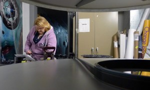 Oak Harbor Cinemas Manager Sherry Sloyke prepares a film