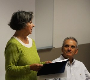 Linda Beeman reads from her book of poems entitled “Collateral Damage” at the Oak Harbor Library Thursday afternoon as Greg Stone