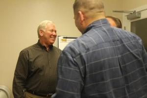 Jim Porter speaks with fellow South Whidbey Parks and Recreation District Commissioners Don Wood and Matt Simms at his final meeting