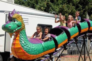 Youngsters catch some air while riding one of the Whidbey Island Fair’s roller coasters.