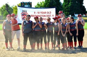 Central Whidbey celebrates after defeating North Whidbey 15-9 in the District 11 championship game Saturday. The team earned their second consecutive trip to the state softball playoffs
