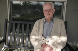 Leland 'Mac' McCloskey sits for a moment in the sun outside the Maple Ridge Assisted Living Community facility where he lives.