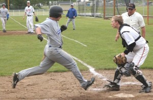 Falcon senior Aaron Curfman stretches for home against Mount Baker on Thursday. South Whidbey staved off elimination from the 1A District 1 baseball tournament by beating Mount Baker 7-2.