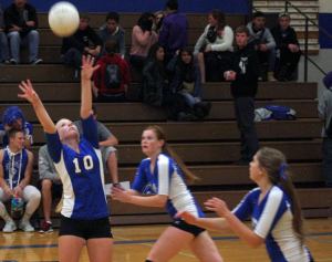 Falcon senior setter Meagan Longdon passes to Anne Madsen