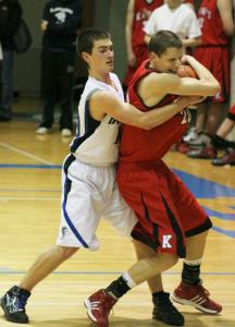 The Falcons' Cole Erikson tries to pop the ball away from King's forward Daniel Berendsen during the Cascade League matchup Tuesday in Langley.