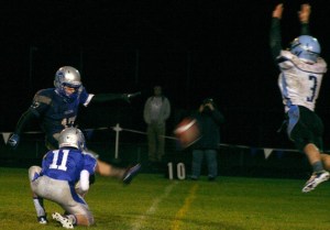 Turk senior Jay Leverett leaps to block Falcon kicker Cameron Coupe’s extra point attempt Friday night. Leverett also blocked a punt and returned it for a touchdown.