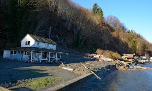 A mudslide in Old Clinton destroyed one beach cabin and heavily damaged another Sunday. No one was hurt but one of the structures is a total loss.