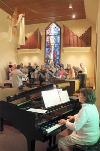 Bill Humphreys leads the choir at Langley United Methodist Church during a recent rehearsal. It was one of his last