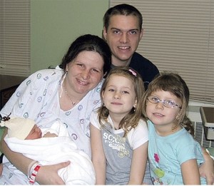 Bronwyn Messer holds her brand new baby boy Brody Shawn Messer while dad