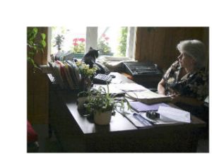 Randy does some bird-watching on the desk of Marlyne Ray. Randy and fellow city cat Austin call Langley’s city hall home.