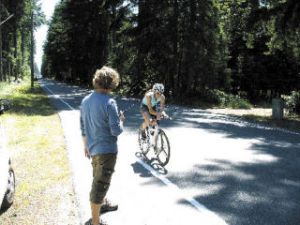 Film producer Brad Lenz directs actress Karlee Brandner as she rides a Scott bicycle down Bayview Road on Wednesday.