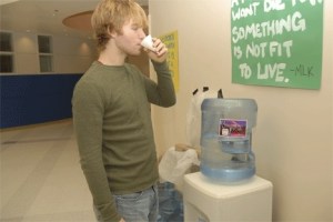 South Whidbey High School senior Sean Hough drinks water from a hallway water station. The school district hopes to begin construction in March for a new system that will make the districts water drinkable.