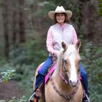 Diana Putney trots down the trail at Putney Woods.