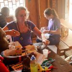 Donald Miller photo Linda Jacobson and a Haitian nursing student treat a patient in a Among the Reeds clinic.