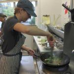 Co-owner Stephanie Pendell quickly whips up noodles in a wok.
