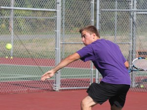 Falcon senior Jonathon Peterson reaches for a forehand in practice at South Whidbey High School.