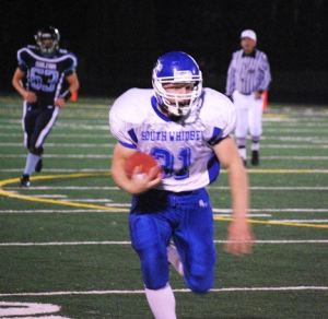 Falcon fullback Danny Zuver rushes 20 yards for a touchdown during South Whidbey’s 42-30 victory over the Sultan Turks.