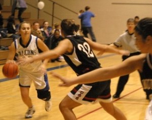 Falcon Alannah Alber tries to fend off Archbishop Murphy’s premiere defender Alyssa Smith Friday. South Whidbey lost to the Wildcats 74-32. At 5:15 p.m. Saturday
