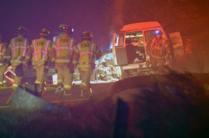 South Whidbey Fire/EMS firefighters walk the scene of a fatal two-car crash on Highway 525 in February. Tim Keil died at the scene and the driver