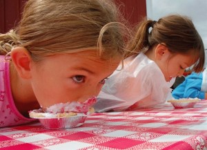 Seattle resident and two-year reigning pie-eating contest champ Madden Gillespie works on her third consecutive victory at the Loganberry Festival at Greenbank Farm this past weekend.