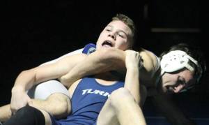 Falcon senior Kyrell Broyles works to take down Sultan junior Dylan Oster in the 160-pound match on Thursday