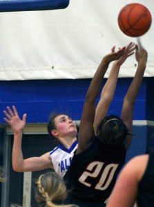 Falcon senior Ellie Greene blocks Coupeville senior Jai’Lysa Hoskins on Friday night.