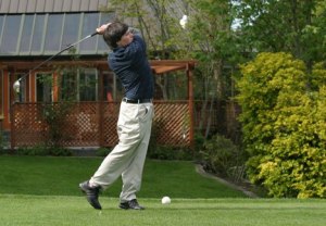 Falcon varsity golfer Jesse Portillo tees off on the par-4