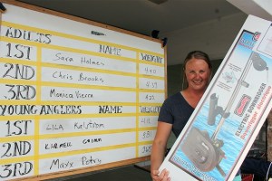 Sarah Holm holds up her first-place prize