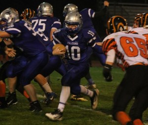 Deven Damerau finds a hole on the left side of the offensive line and bursts through for a big gain Friday against Granite Falls.