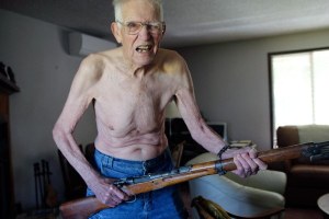 North Whidbey resident Dave Olinger shows his ‘ferocious’ face while holding a rifle. He is a write-in candidate for Island County sheriff.