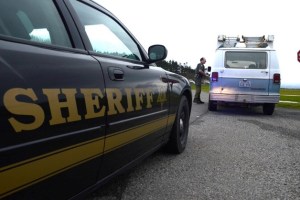 Island County Sheriff’s deputy Chris Garden gives a motorist a speed warning at Camp Casey on Central Whidbey. Sheriff Mark Brown is juggling critical staffing levels and is again seeking support for a law and justice tax.