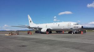 Personnel assigned to P-3C Orion squadrons at NAS Whidbey Island line up to tour the cabin of the Navy’s newest land-based