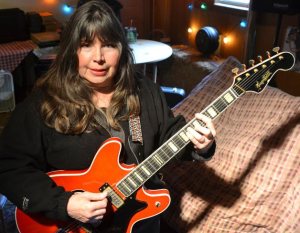 Rainey of the Rainey Music Project rehearses a song she wrote for the upcoming performance benefitting at-risk youth on the South End. The performance features all-original rock music the band wrote for the concert.