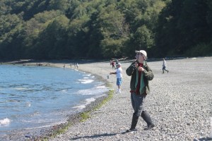 Scott T. Starbuck reels in a small pink salmon on Thursday morning from Bush Point. He had already caught two and released this one because it was a little small for his tastes. Below