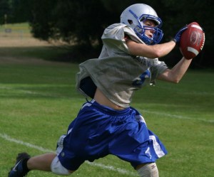 Cameron Coupe hauls in the ball during route drills with the receiving corps. The Falcon senior will be relied upon heavily as the team’s all-conference kicker