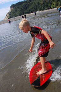 Emmett Roy Layman skimboards across the tide flats at Double Bluff. The 6-year-old Langley resident was one of 17 students participating in a South Whidbey Parks and Recreation skim-boarding program put on by Jack’d Skimboards.