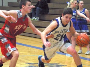 Falcon senior Josh Bishop drives to the corner against Knight sophomore Josh Alexander on Friday. Below