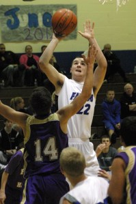 Tyler “Chuck” Norris (22) goes up for two against Friday Harbor defender Tanner Buck. Norris and his teammates used their size to control the paint. Norris finished with 12 points and five rebounds.