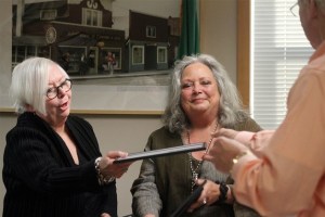 Denise LaRue accepts a mayor’s excellence award from Langley Mayor Fred McCarthy at the Oct. 19 city council meeting