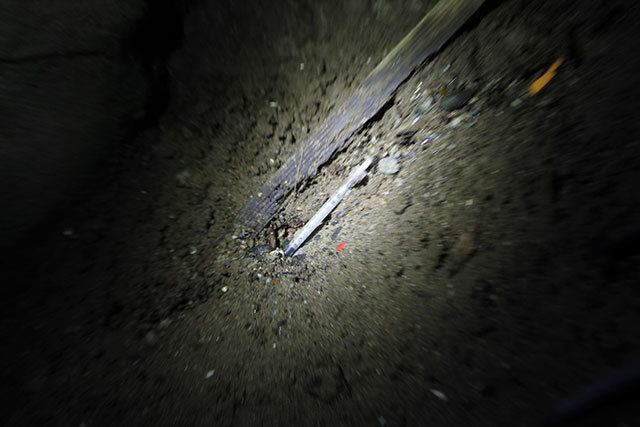 Evan Thompson / The Record                                A used syringe was found underneath the patio deck of the Dog House in Langley during a patrol by Langley Police Officer Mason Shoudy on Thursday, Oct. 4.