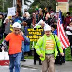 Michael B. Watkins/Whidbey News Group                                Protesters opposing the Dakota Access Pipeline stand outside Wells Fargo Bank in Coupeville Tuesday. The group opposes the bank funding the pipeline project and the potential impact to the environment.