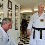 Kyle Jensen / The Record Sensei Warren Berto (left) and sempai, or senior student, Butch Donaldson (right) take a break from training at Berto&rsquo;s Bayview dojo.
