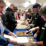 Record file                                A long line of volunteers packages dinners for those who otherwise wouldn&rsquo;t eat Thanksgiving.