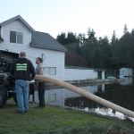 Kyle Jensen / The Record                                Contractors pump storm water from an empty lot at Brighton Beach in Clinton. The lot and the surrounding area was estimated to be submerged in about four feet of water.