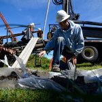 J. Glenn Mutti-Driscoll, a hydrogeologist with Seattle-based Pacific Groundwater Group, looked at a core sample dug on a 24-acre property in Freeland in late April, 2015. It was among several tests the Freeland Water and Sewer District had performed in preparation for purchasing the 24-acre property for $800,000 late last year. A recent discovery has the district commissioners concerned about costs and whether the land will work for part of its intended use.