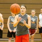 Evan Thompson / The Record                                Falcon senior Megan Drake passes to teammate Kolby Heggenes during practice Tuesday afternoon.