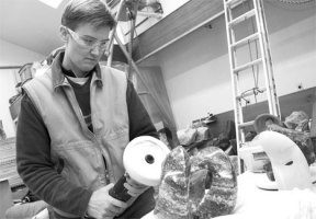 Sue Taves at work in her stone sculpture studio.